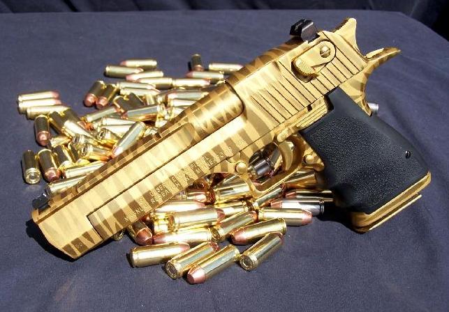aa-gun-gold-color-w-bullets-beside-it