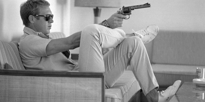 At his bungalow in Palm Springs Steve McQueen practices his aim before…