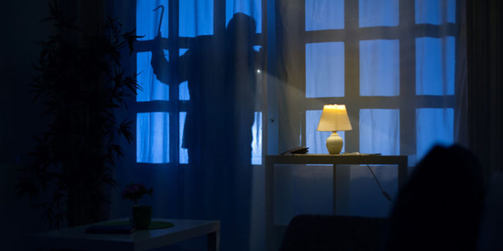48121316 shadow of burglar on the balcony door