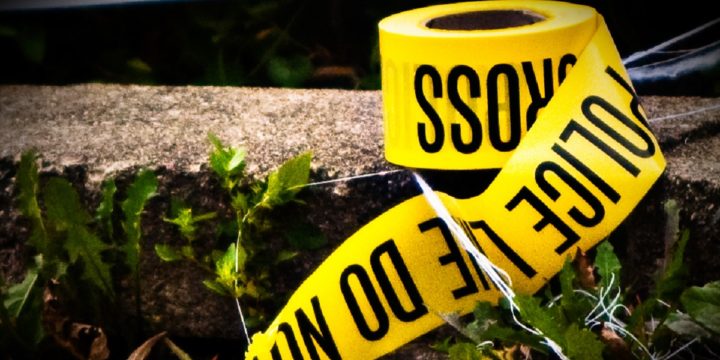 Police tape on curb