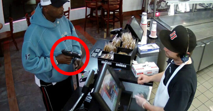 [VIDEO] Armed Robber Tries To Chamber Round During Hold-up, Fails To Feed, Cashier Calmly Hands Over Cash