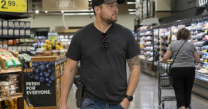 Man shopping with visible firearm